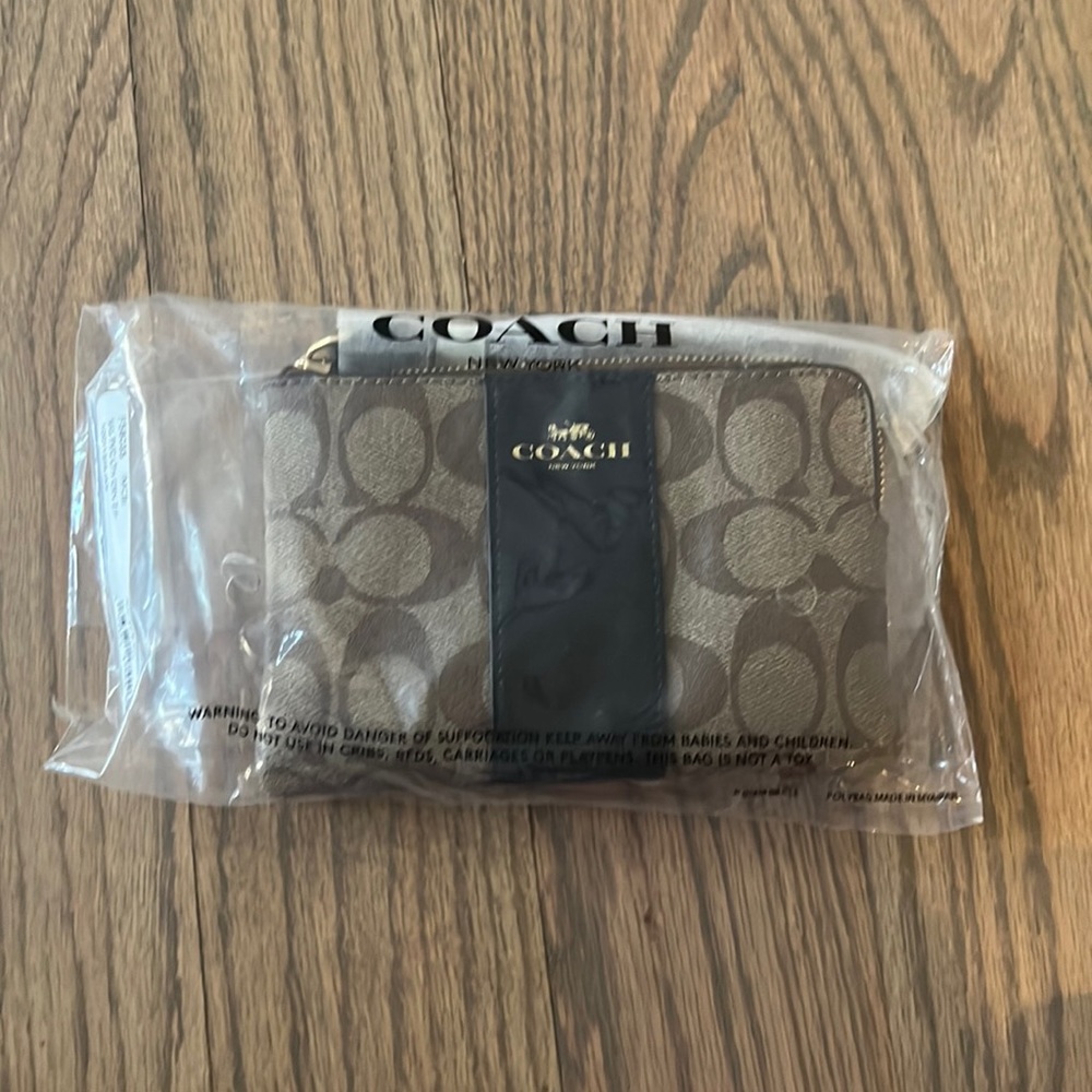 Coach corner zip wristlet.